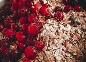 A Close-Up Shot of Rolled Oats and Berries in a Bowl